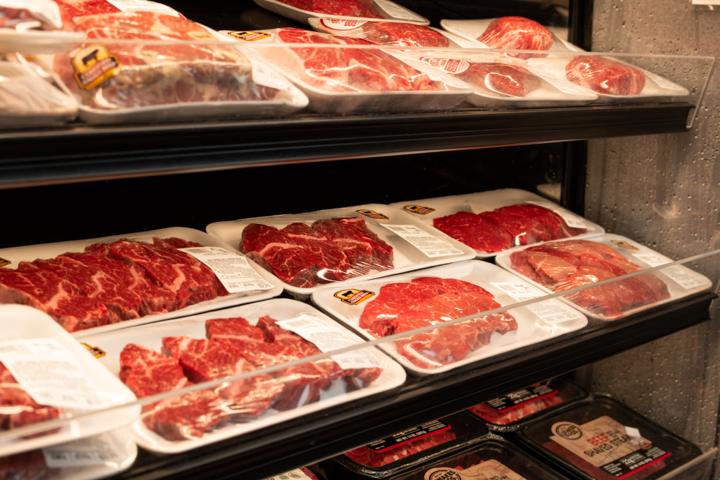 Fresh-cut steaks displayed in the butcher case
