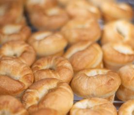 Fresh-baked bagels cooling on a wire rack