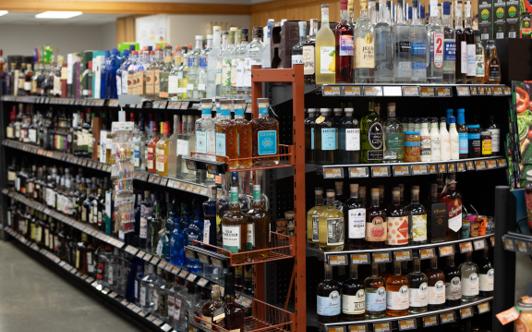 The beer, wine, and liquor department with shelves of spirits and wine